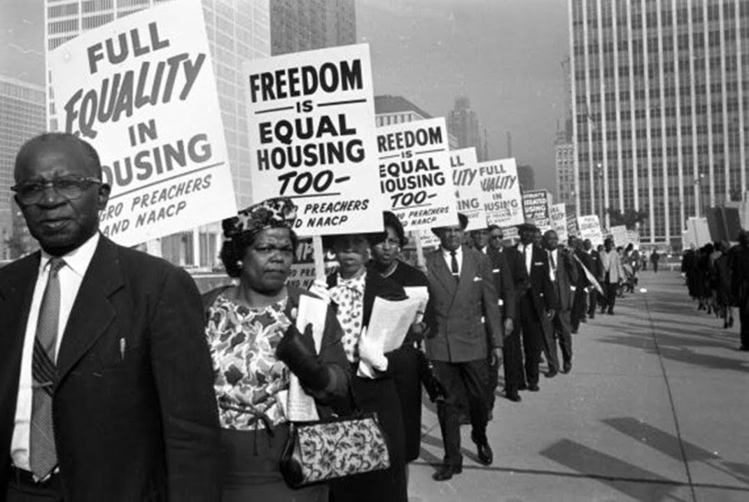 Afircan Americans protesting
						for equal housing in the 1960s