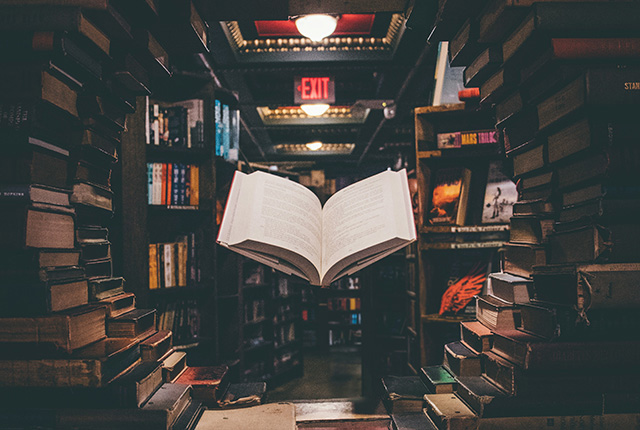 Floating book surrounding in a circle by other books